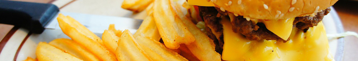 Eating Burger at HUFF 'N' PUFF restaurant in Randle, WA.